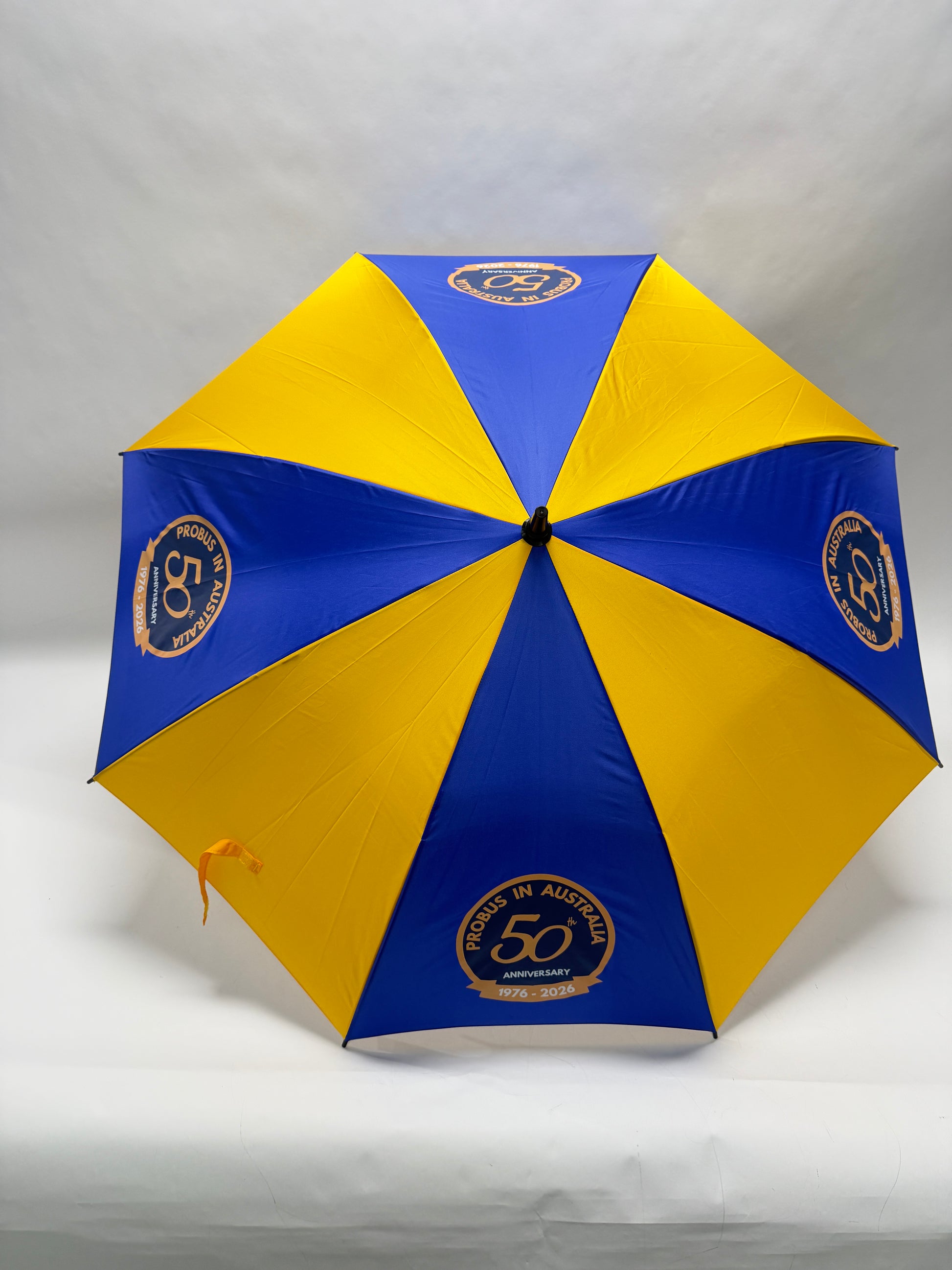Blue and yellow umbrella with a logo on a white background